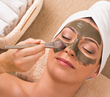 Woman relaxing with a customized facial